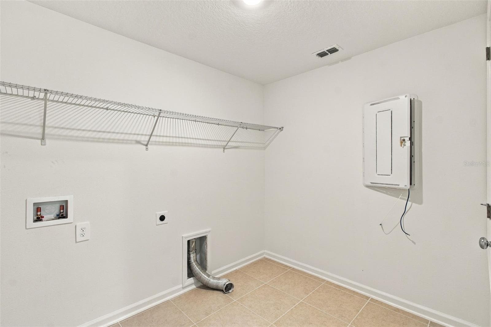 . A spacious laundry room just off the garage offers added convenience and wire shelving for storage. - 2007 FORAGE DR, KISSIMMEE