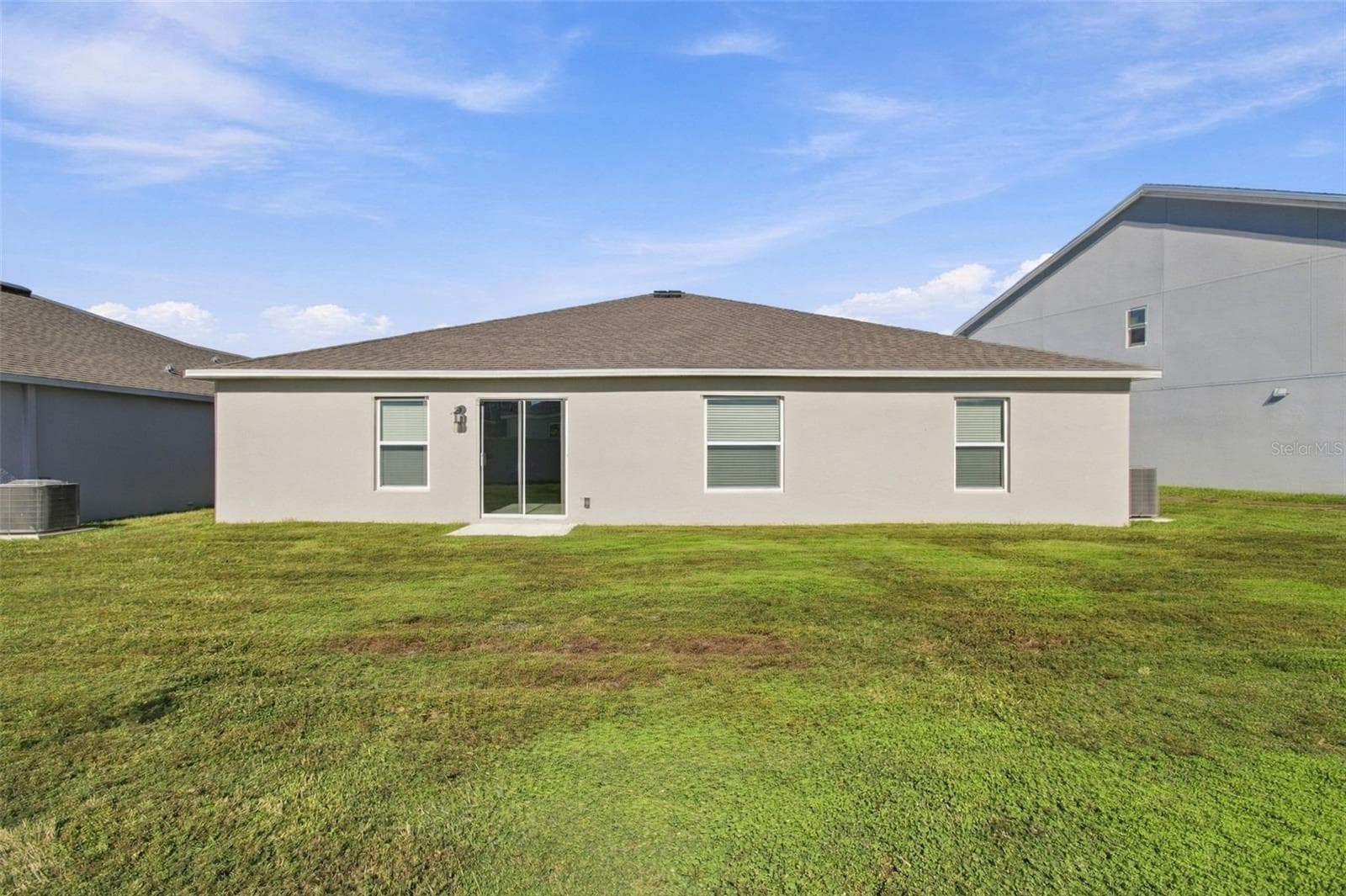 Enjoy the outdoor patio and spacious backyard, with plenty of room to add a fence. - 2007 FORAGE DR, KISSIMMEE