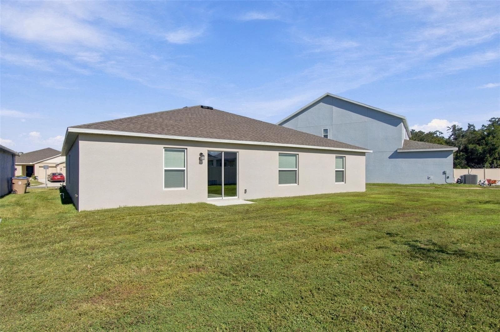 Enjoy the outdoor patio and spacious backyard, with plenty of room to add a fence. - 2007 FORAGE DR, KISSIMMEE