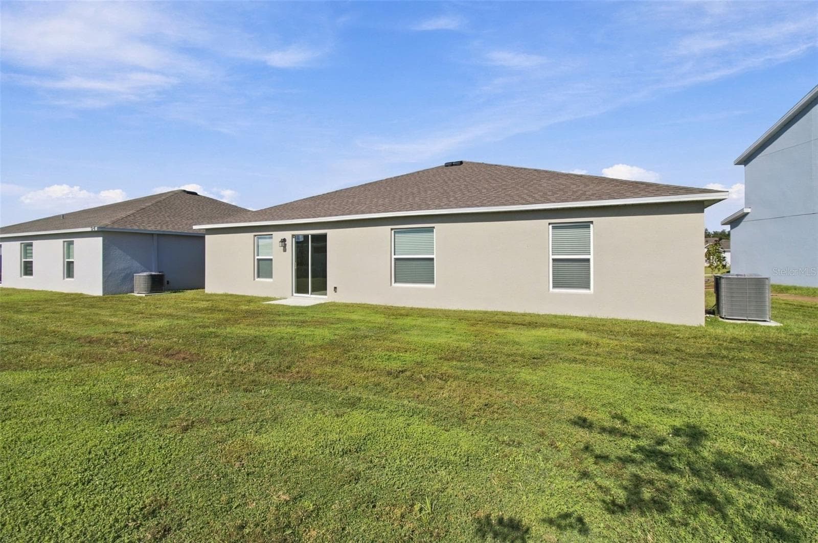 Enjoy the outdoor patio and spacious backyard, with plenty of room to add a fence. - 2007 FORAGE DR, KISSIMMEE