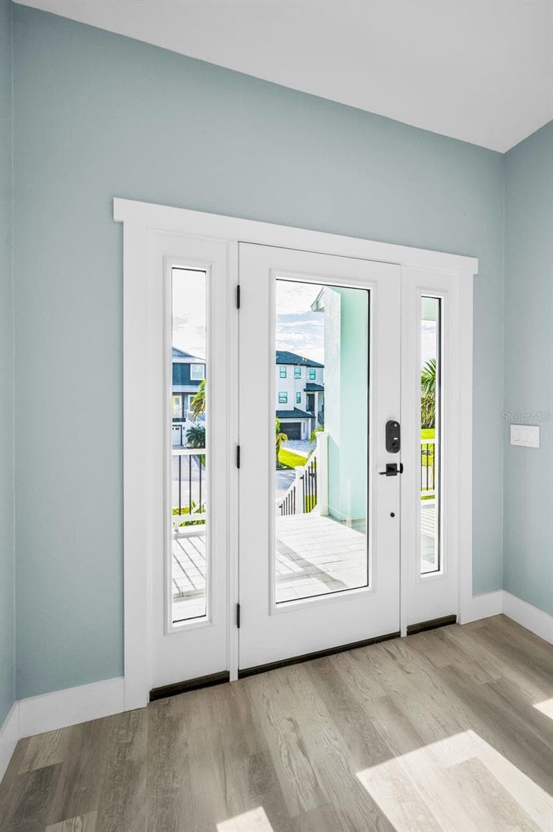 Foyer - Hurricane door and Luxury Vinyl - 5650 EGRETS PL, NEW PORT RICHEY