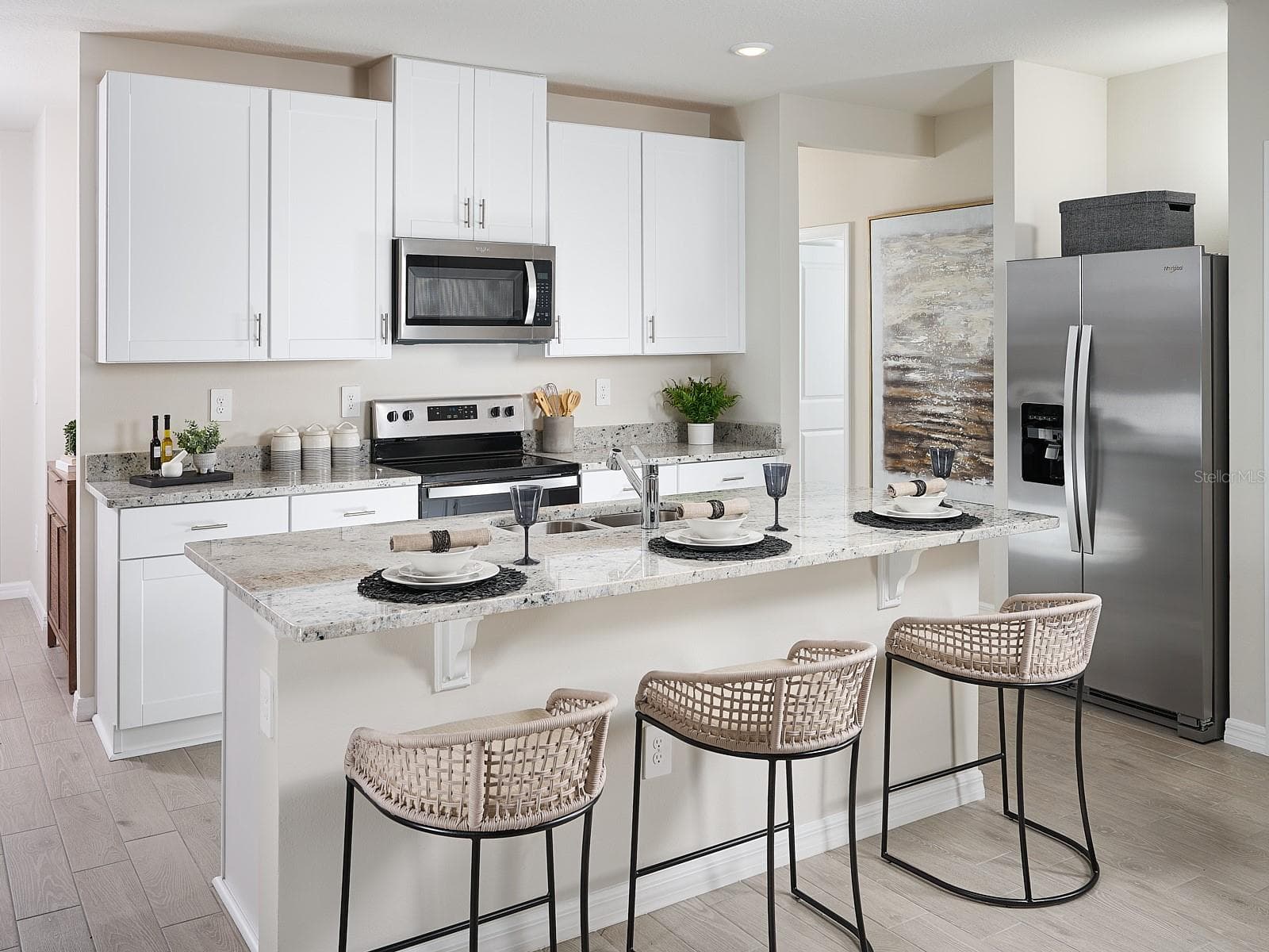 Can you make this description for Coasterra for MLS with a warm but sales appeal: This versatile floorplan offers four bedrooms, two full baths and family room, complemented by an open-concept kitchen, dining area, and great room designed for gathering and entertaining. - 5361 WILLOW CRK, HAINES CITY