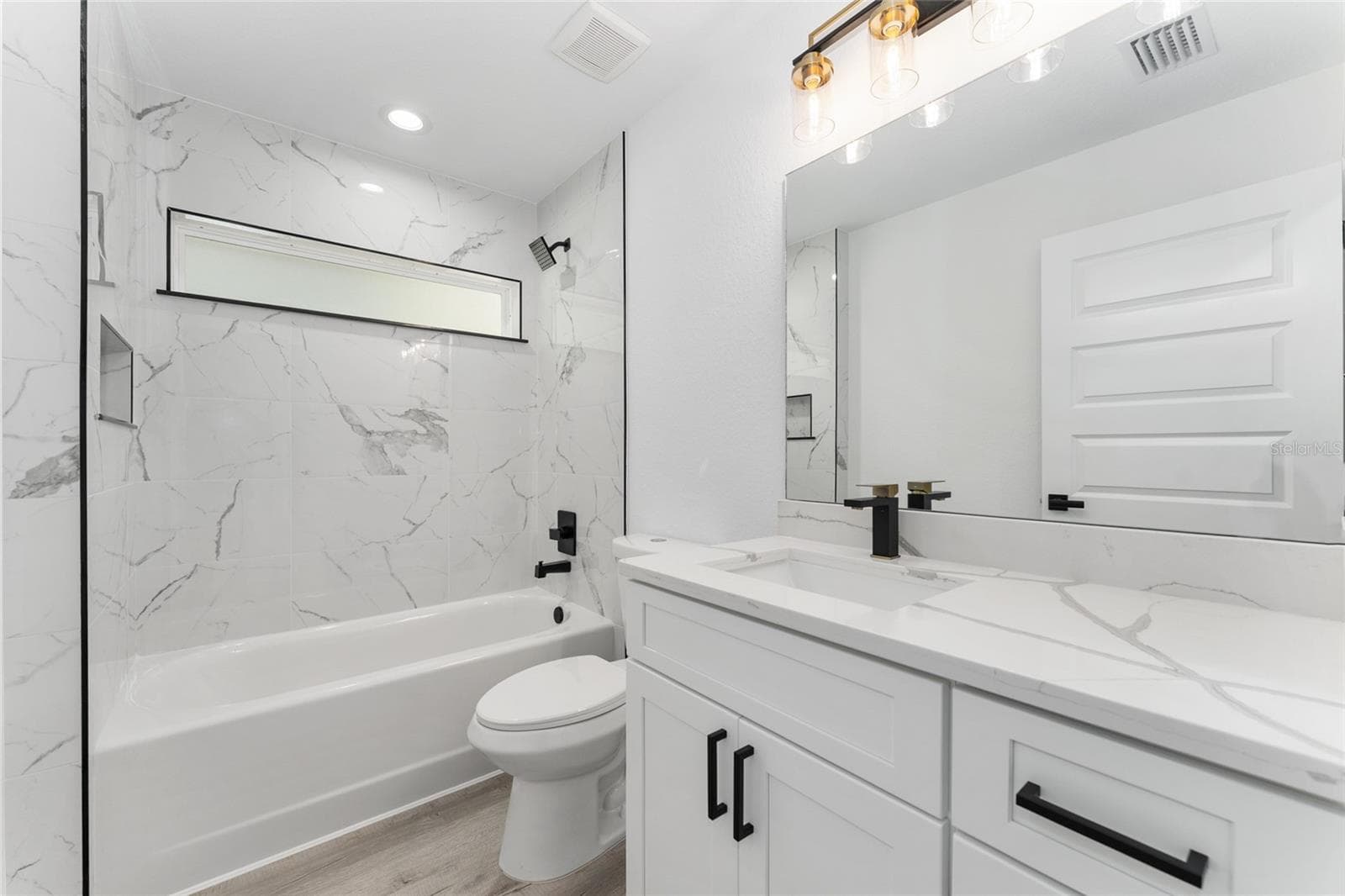 Guest Bath. Actual home will not have gold finishes, only black - 3 PECAN DRIVE TRCE, OCALA