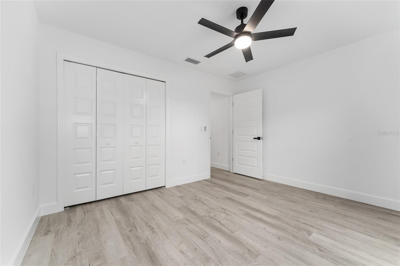Bedroom 2. Actual home will have colonial-style interior doors versus what is shown. - 3 PECAN DRIVE TRCE, OCALA