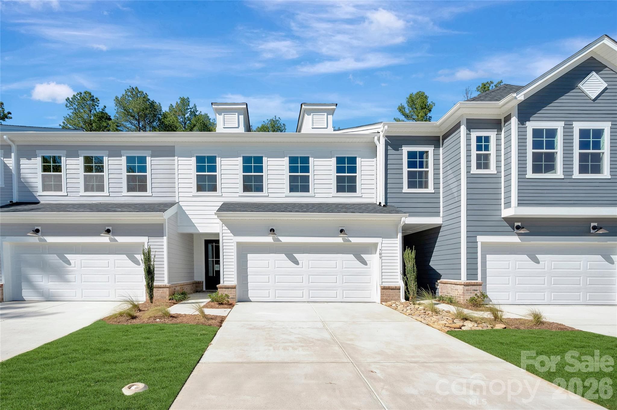 2 Story Townhome featuring a 2 bay front load garage with a full length driveway - 709 Bowery Place, Cramerton
