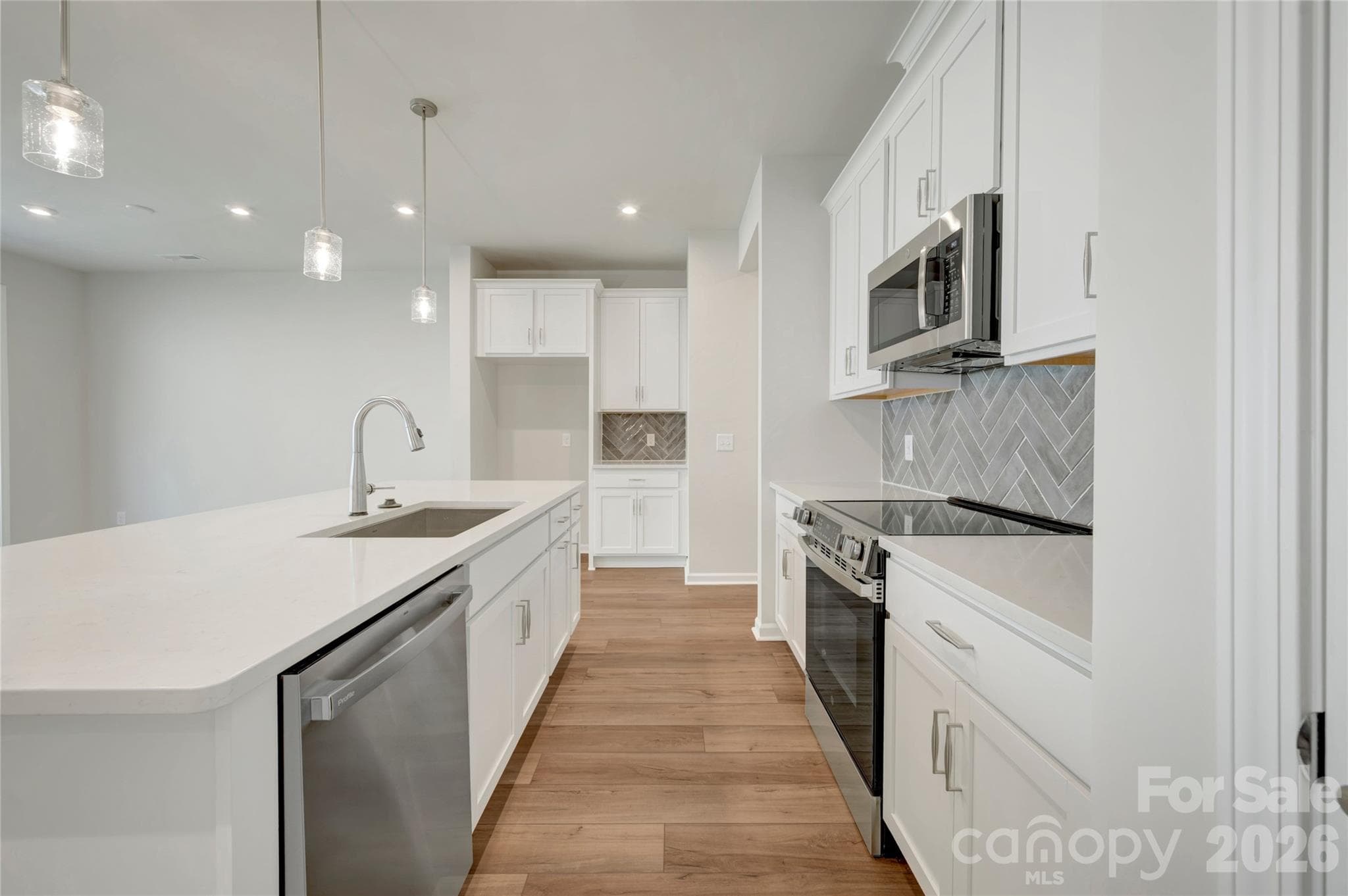 Kitchen with a microwave, electric oven range and dishwasher - 709 Bowery Place, Cramerton