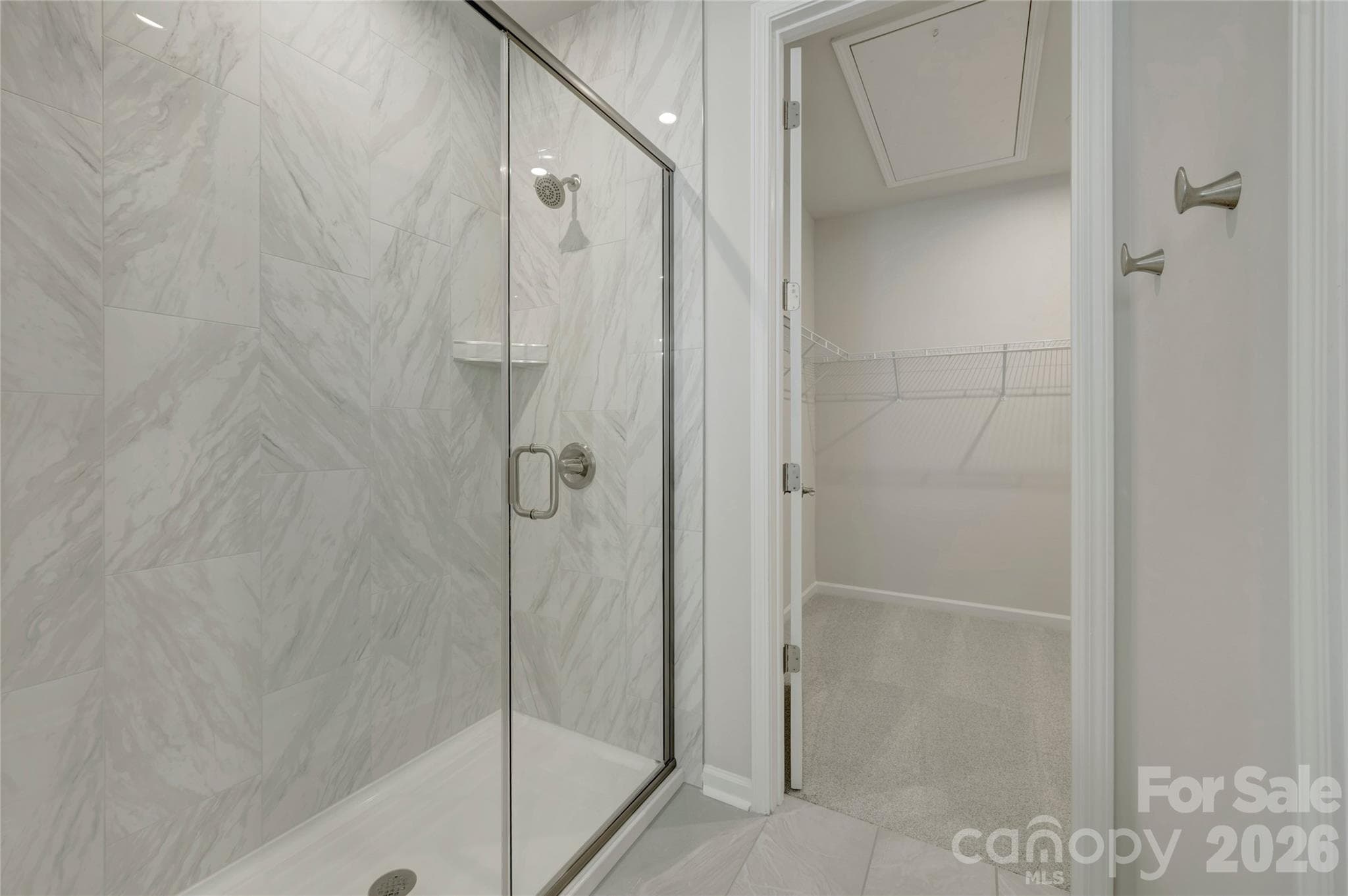 Primary bathroom with a walk-in shower and large walk-in closet - 709 Bowery Place, Cramerton