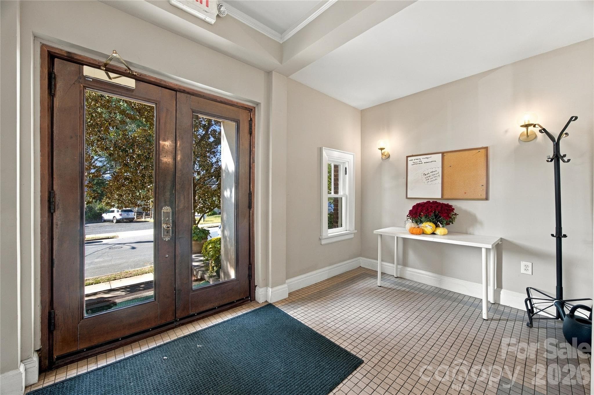 A gracious entry hall welcomes you home. - 712 Louise Avenue, Charlotte
