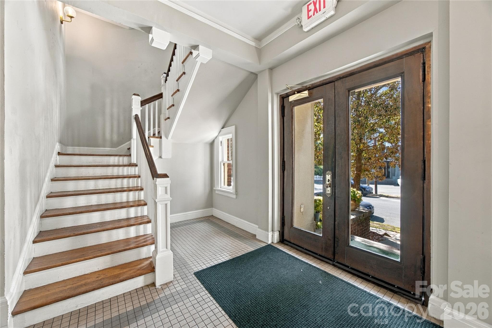 A beautiful staircase sets the tone. - 712 Louise Avenue, Charlotte