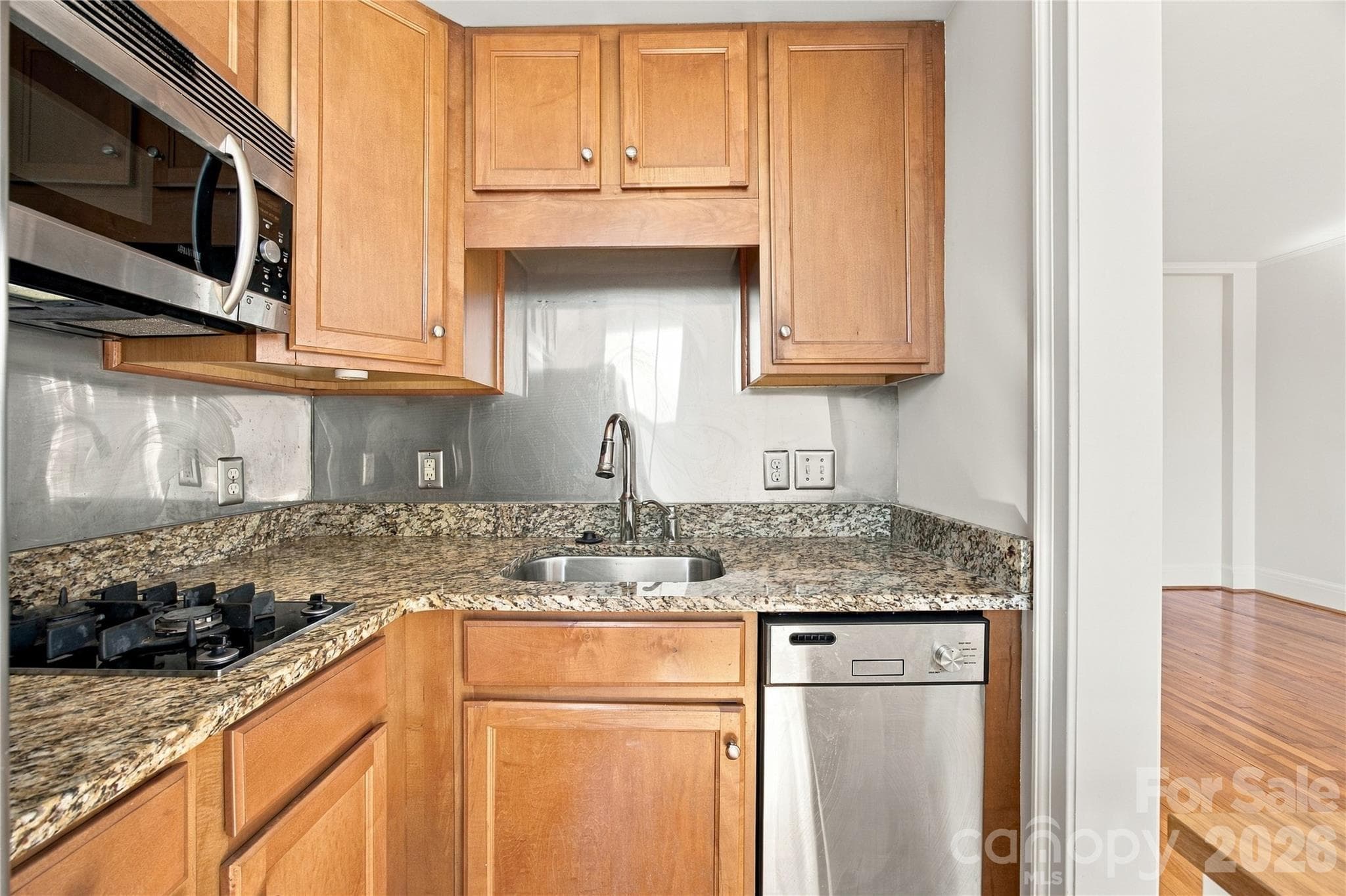 Cook with gas, bake with convection - smart versatility in a charming kitchen. - 712 Louise Avenue, Charlotte