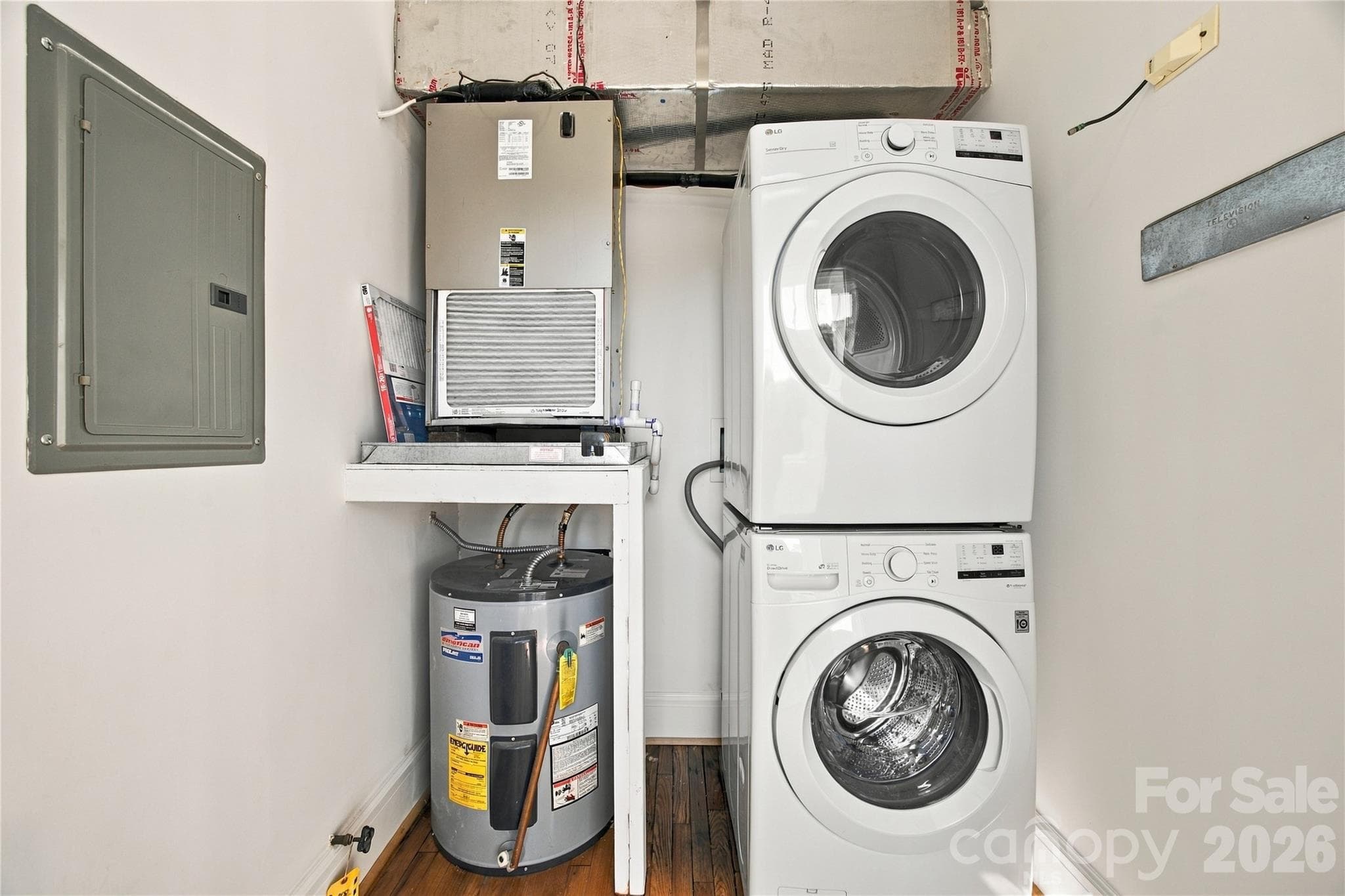 Utility room - Storage meets everyday function in the utility room - full-size washer and dryer included. - 712 Louise Avenue, Charlotte