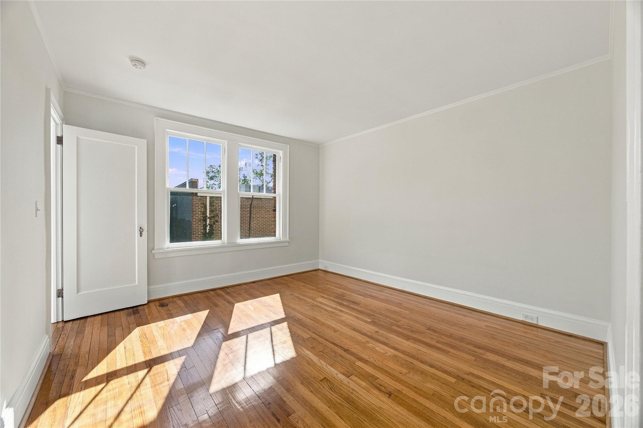 Primary Bedroom - When it’s time to call it a day, this peaceful retreat is a lovely place to land. - 712 Louise Avenue, Charlotte