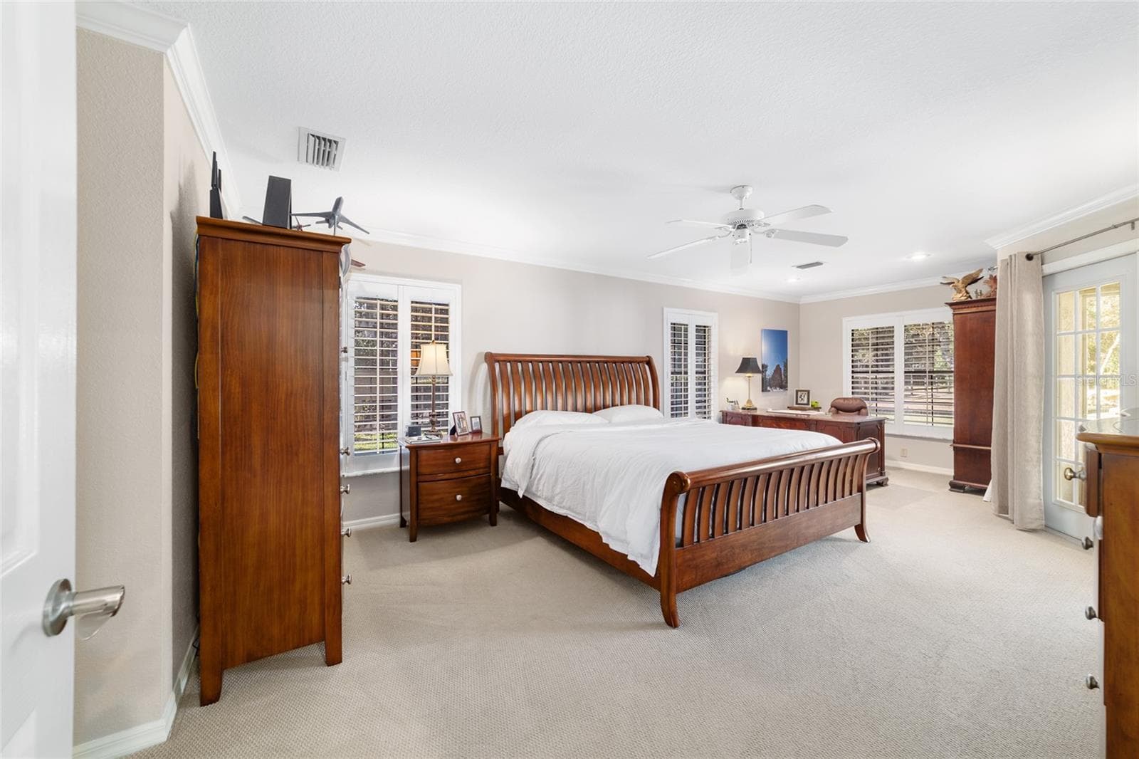 Primary Bedroom with space for an office or workout equipment -Access to the screened in Lani - 3432 SW 51ST TER, OCALA