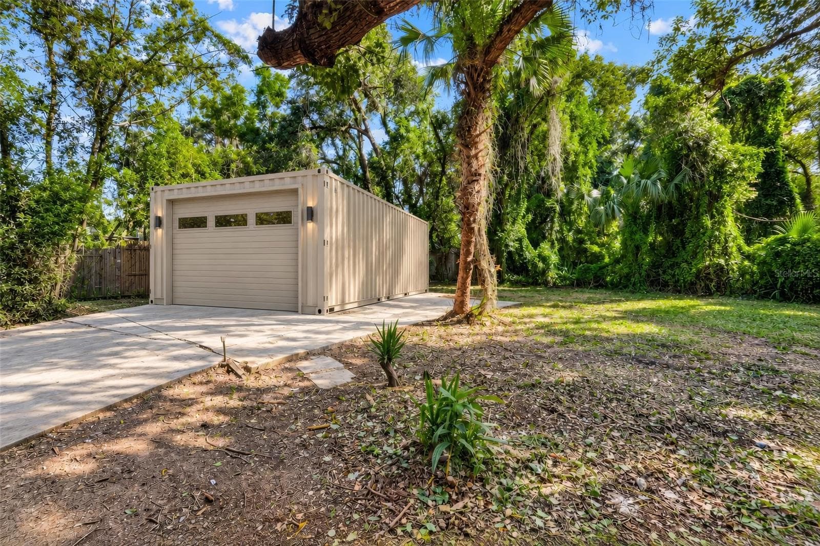 AI-generated depiction of the planned garage, designed to complement the home’s existing exterior and enhance the property’s overall appearance and functionality. The garage will be installed as part of the planned property improvements. Image is for illustrative purposes only and represents the anticipated finished appearance. - 19 E MORNINGVIEW DR, EUSTIS