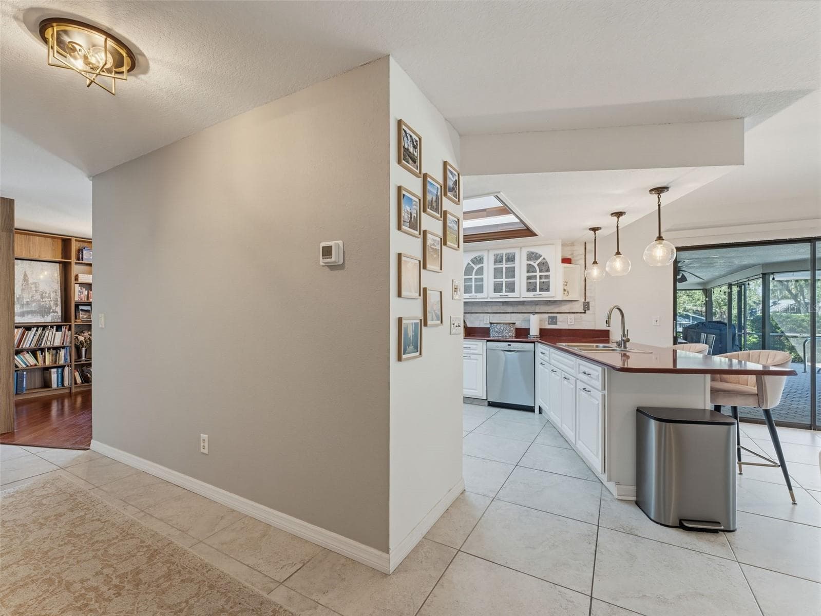 Entry to Hall and Kitchen from Dining area - 3 SUMMIT LN, SAFETY HARBOR