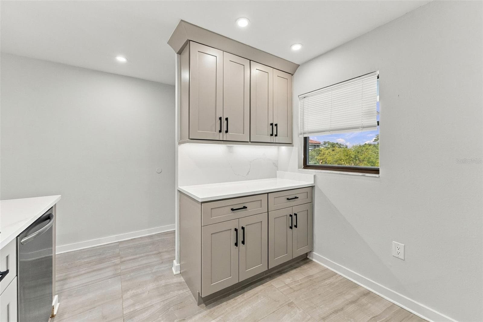 Convenient coffee bar adds extra functionality and storage to the kitchen - 2650 COUNTRYSIDE BLVD #A306, CLEARWATER