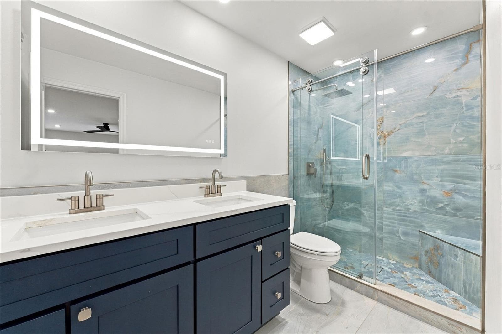Spa-like primary bathroom designed for relaxation and comfort - 2650 COUNTRYSIDE BLVD #A306, CLEARWATER