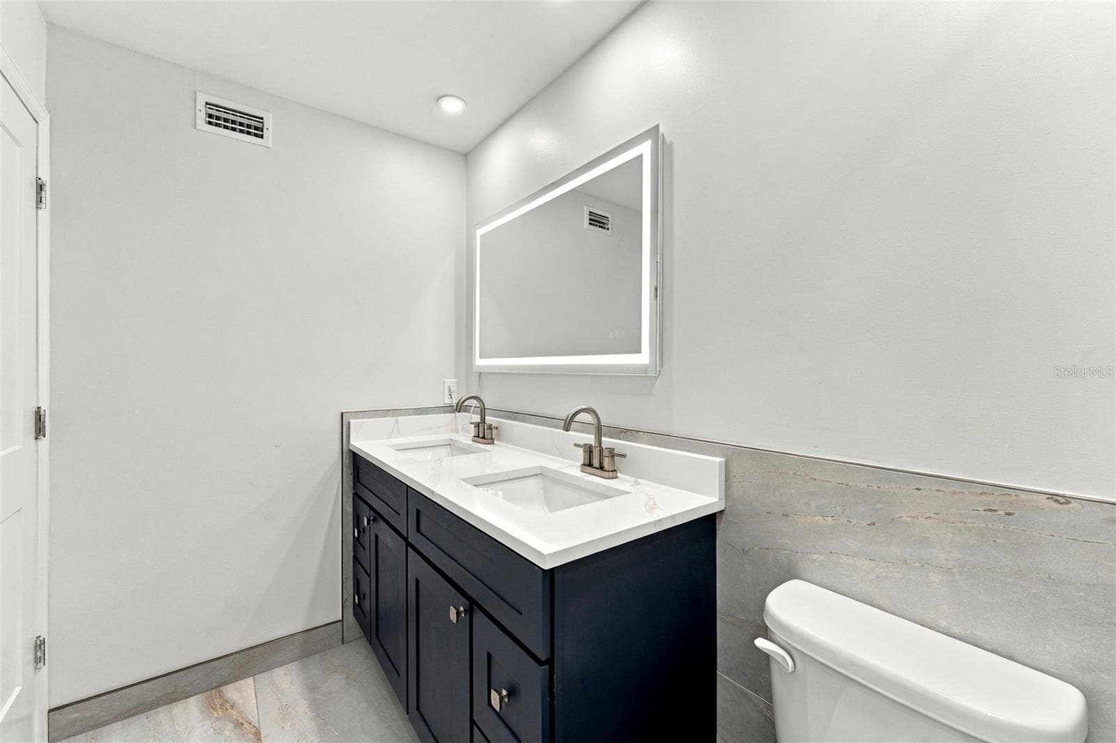 Completely remodeled primary bathroom with a beautiful double vanity - 2650 COUNTRYSIDE BLVD #A306, CLEARWATER