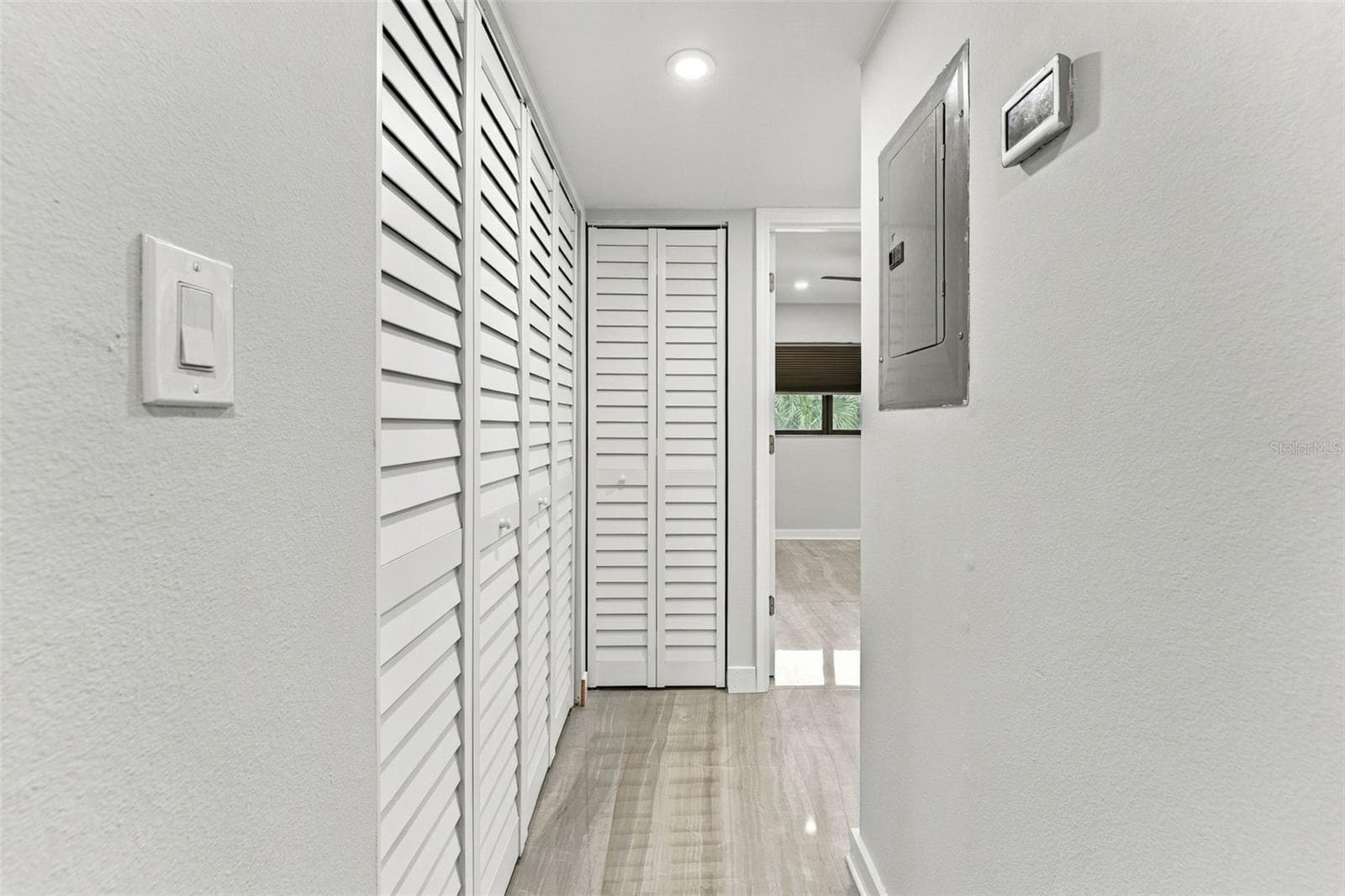Hallway leading to bedroom two and the beautifully remodeled hall bathroom - 2650 COUNTRYSIDE BLVD #A306, CLEARWATER