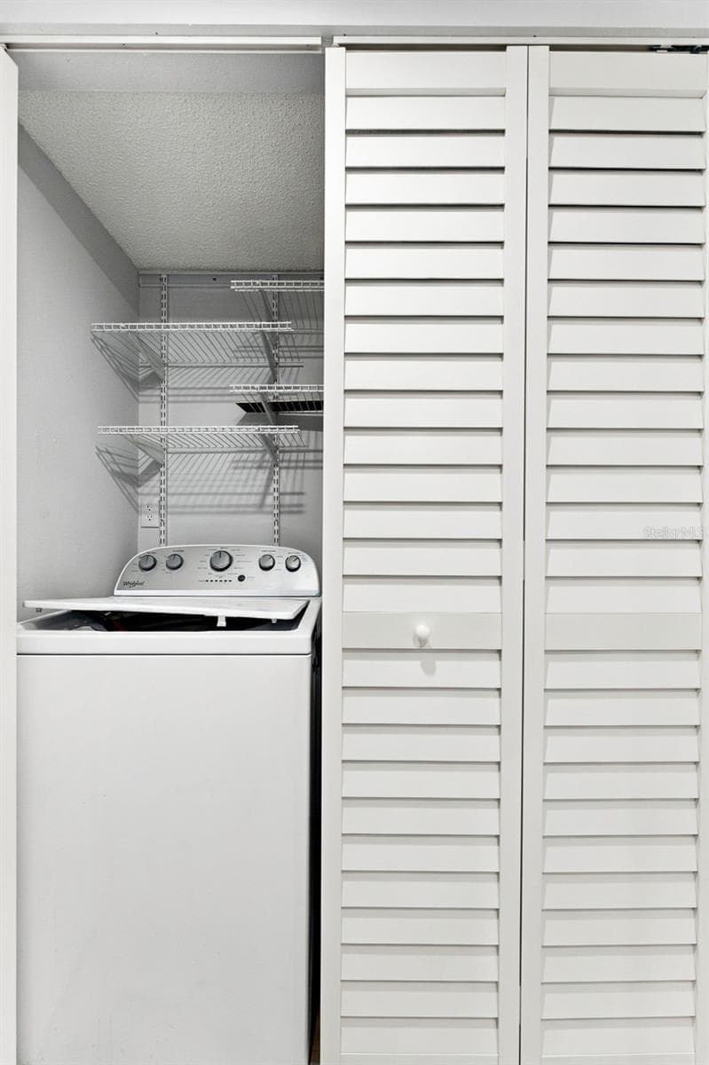 Convenient in-unit washer and dryer for easy everyday living - 2650 COUNTRYSIDE BLVD #A306, CLEARWATER