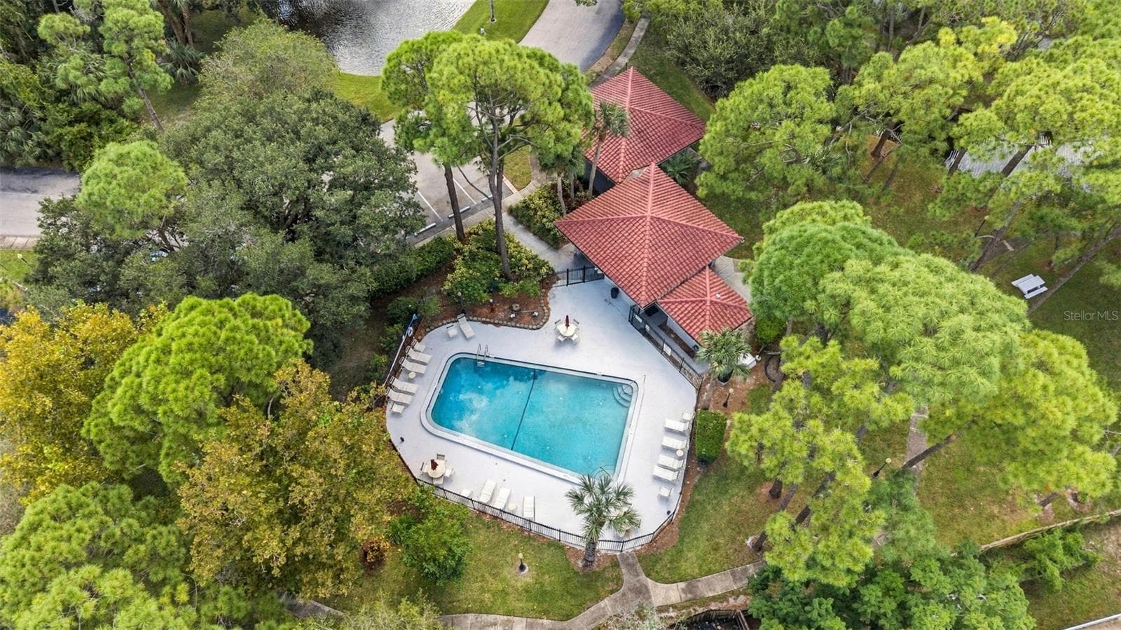 Aerial view of the beautiful community pool and surrounding amenities - 2650 COUNTRYSIDE BLVD #A306, CLEARWATER