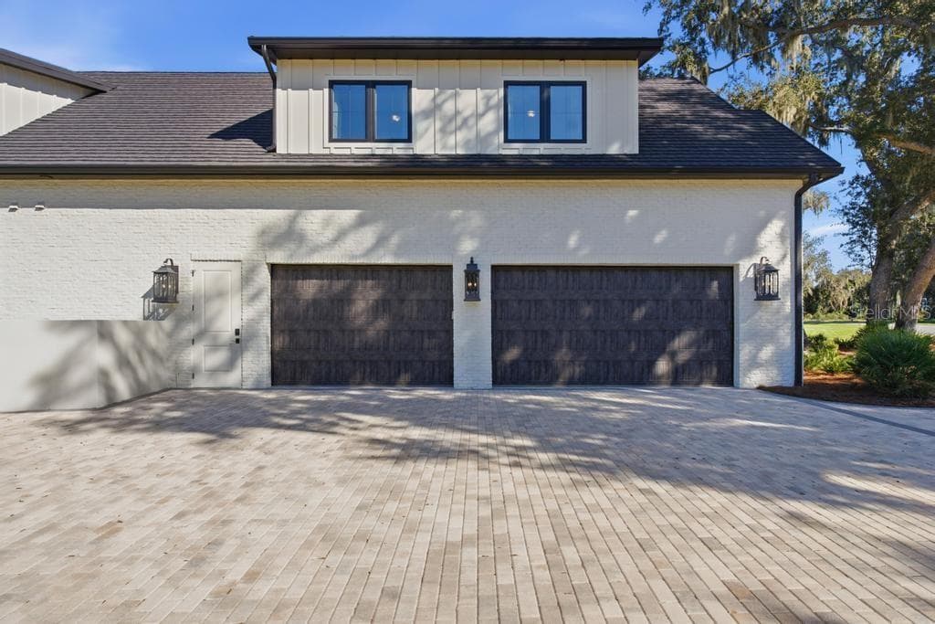 8FT Tall garage doors that open full height - 467 LONG AND WINDING RD, HOWEY IN THE HILLS