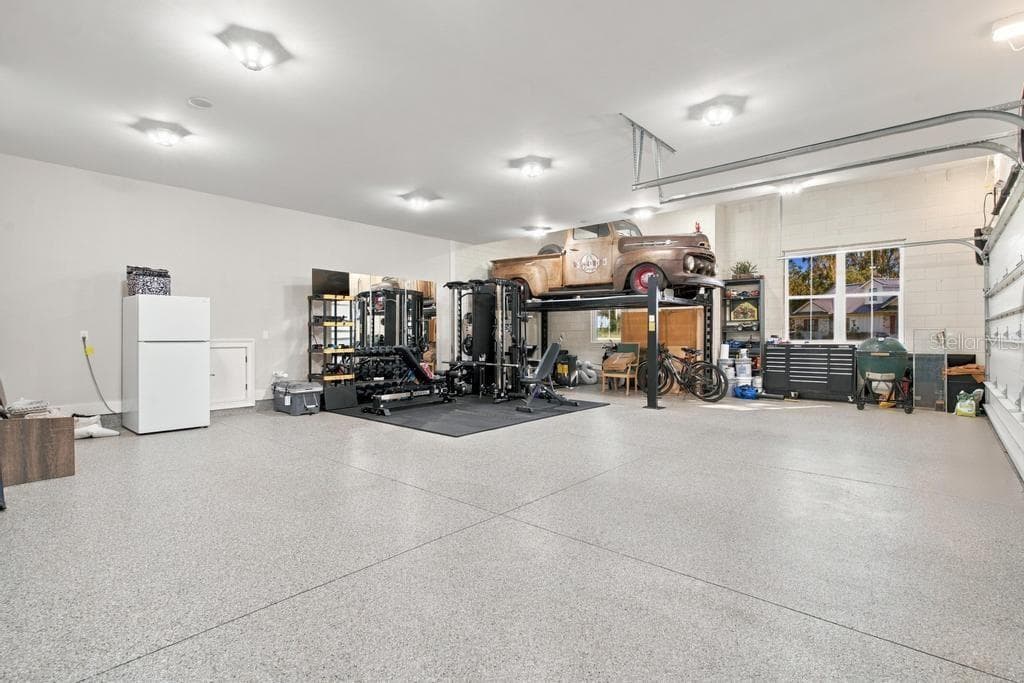 CAR LIFT NEGOTTABLE ...For Your Car Enthusiast - 467 LONG AND WINDING RD, HOWEY IN THE HILLS