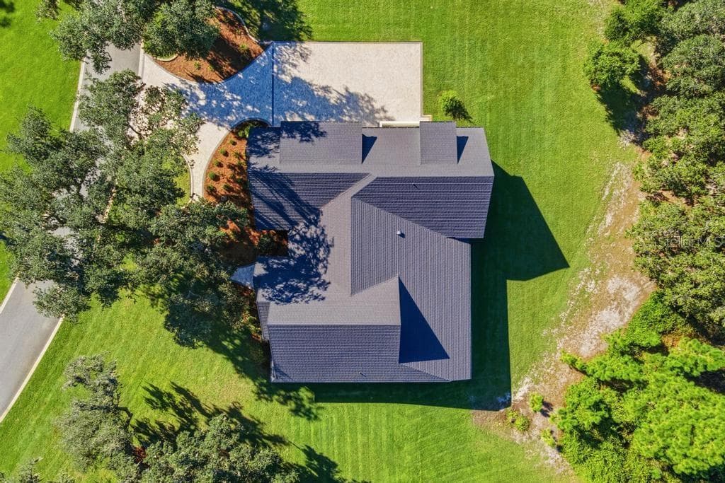 Ariel of home showing long lasting "STONE COATED" METAL ROOF - 467 LONG AND WINDING RD, HOWEY IN THE HILLS