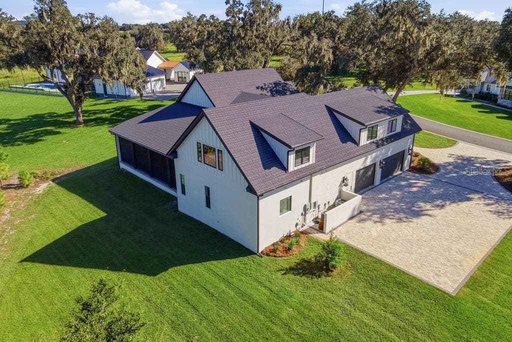 Ariel of home side/ rear view... lots of additional parking room available! - 467 LONG AND WINDING RD, HOWEY IN THE HILLS