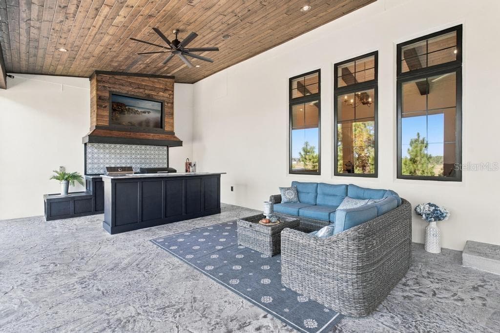 Love this wood ceiling with interior switched fans - 467 LONG AND WINDING RD, HOWEY IN THE HILLS