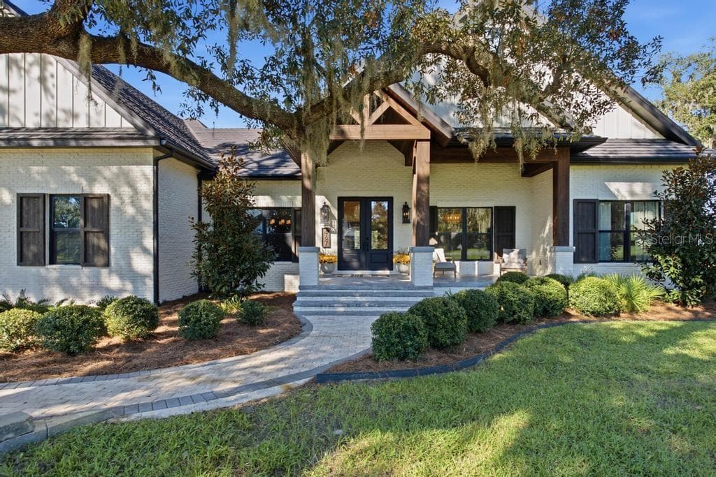 Attractive Entrance with custom laminated post and beams wrapped with rough sawn cypress - 467 LONG AND WINDING RD, HOWEY IN THE HILLS
