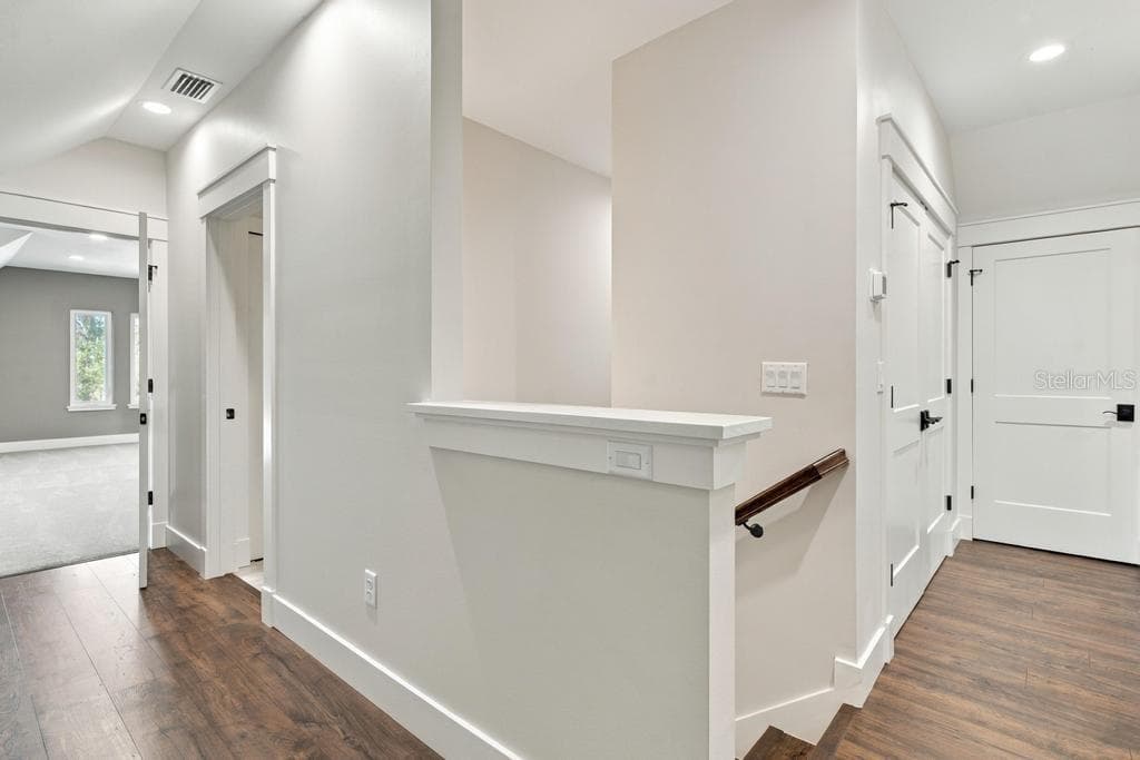 Upstairs hallway leads to bedrooms three and four, bonus family room, and "Flex space" - 467 LONG AND WINDING RD, HOWEY IN THE HILLS