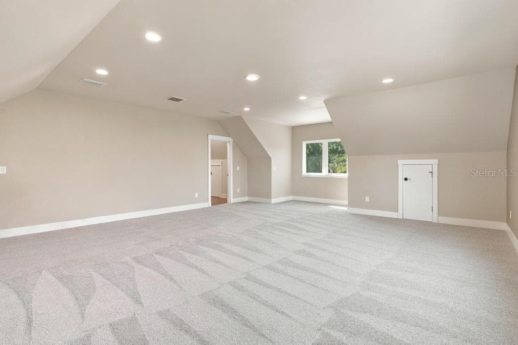 Bonus Family room could be a great "Man Cave", with two walk-in storage closets! - 467 LONG AND WINDING RD, HOWEY IN THE HILLS