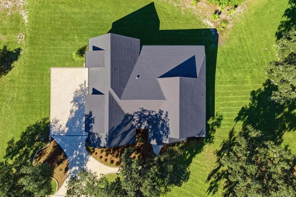 Ariel of roof and driveway - 467 LONG AND WINDING RD, HOWEY IN THE HILLS