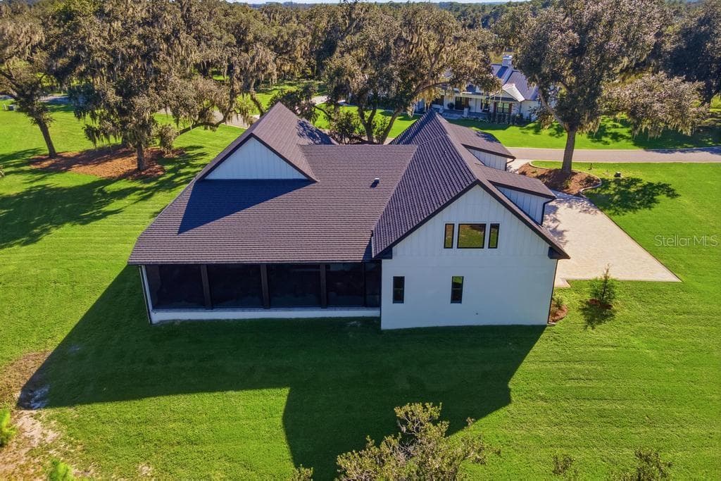 Ariel of rear of home and yard - 467 LONG AND WINDING RD, HOWEY IN THE HILLS