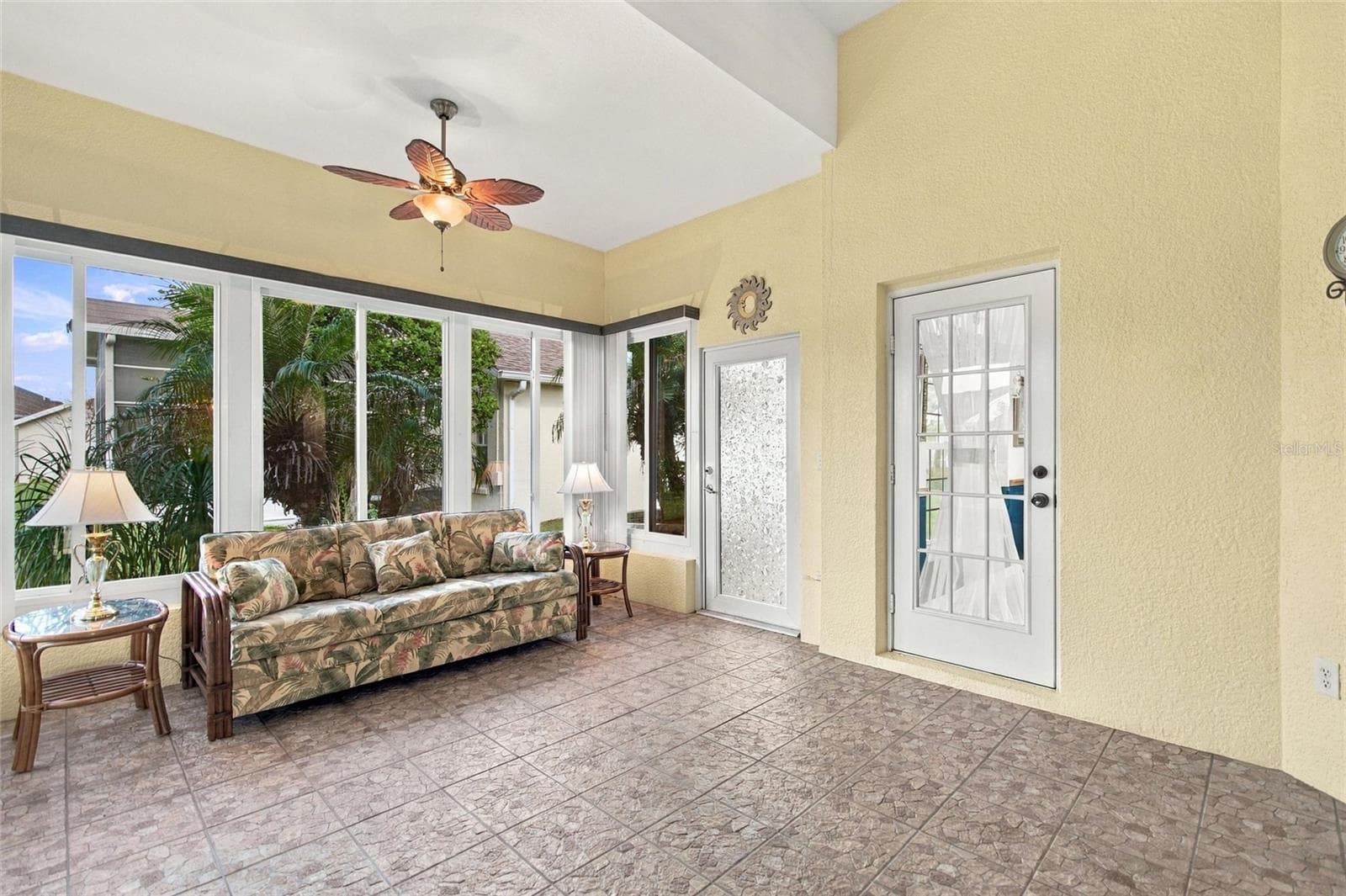 Florida Room with access door to Under-Roof Patio - 148 RED MAPLE PASS, DAVENPORT