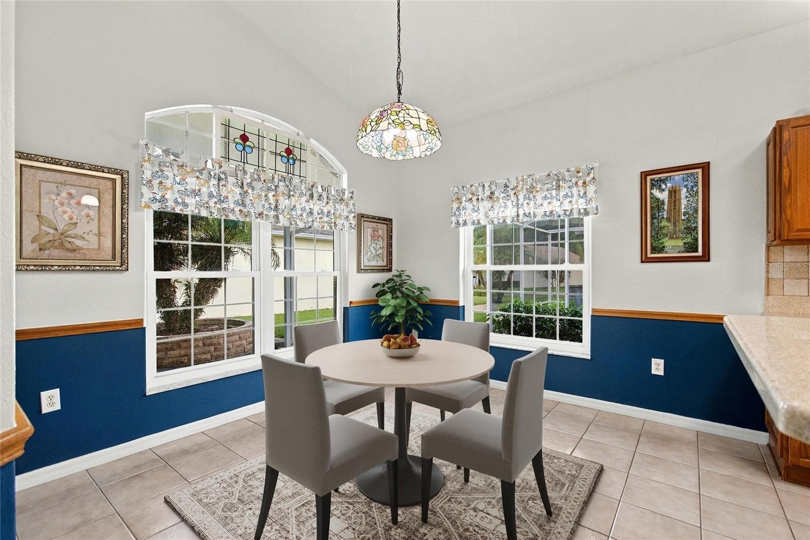 Virtually staged Kitchen eating area has vintage transom window - 148 RED MAPLE PASS, DAVENPORT