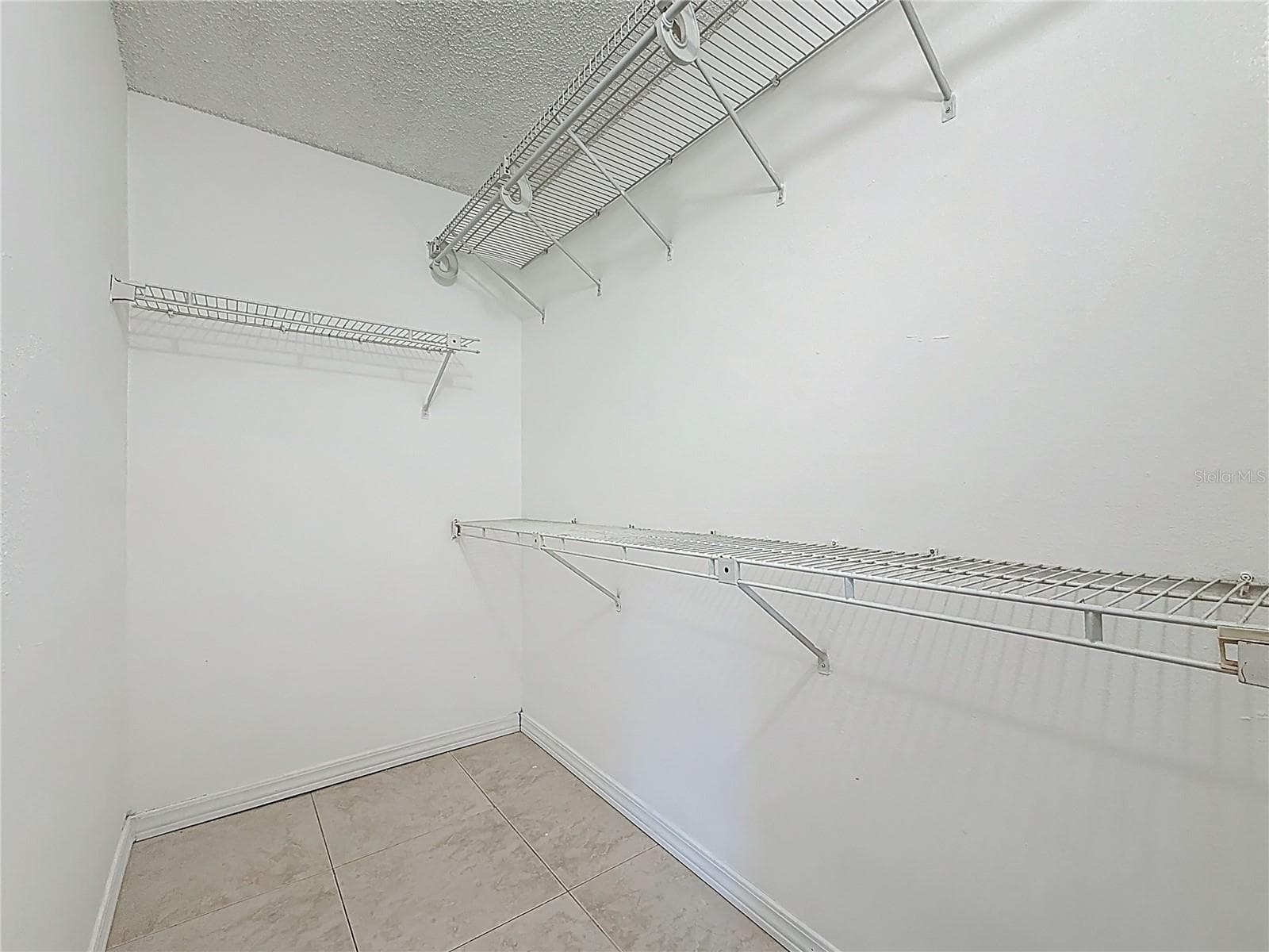 Primary Walk-in Closet - 4022 TUMBLE WOOD TRL #101, TAMPA