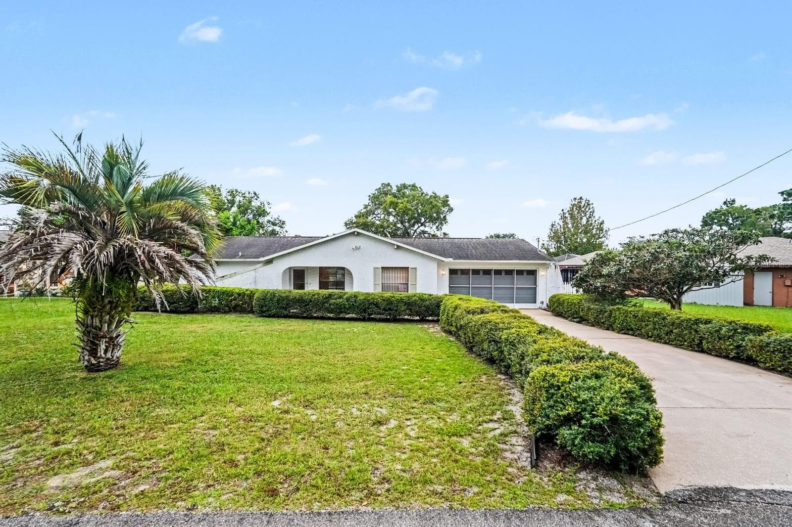 Mature Landscaping Frames This Single-Story Home with Palm Trees - 12128 KATHERWOOD ST #20, SPRING HILL