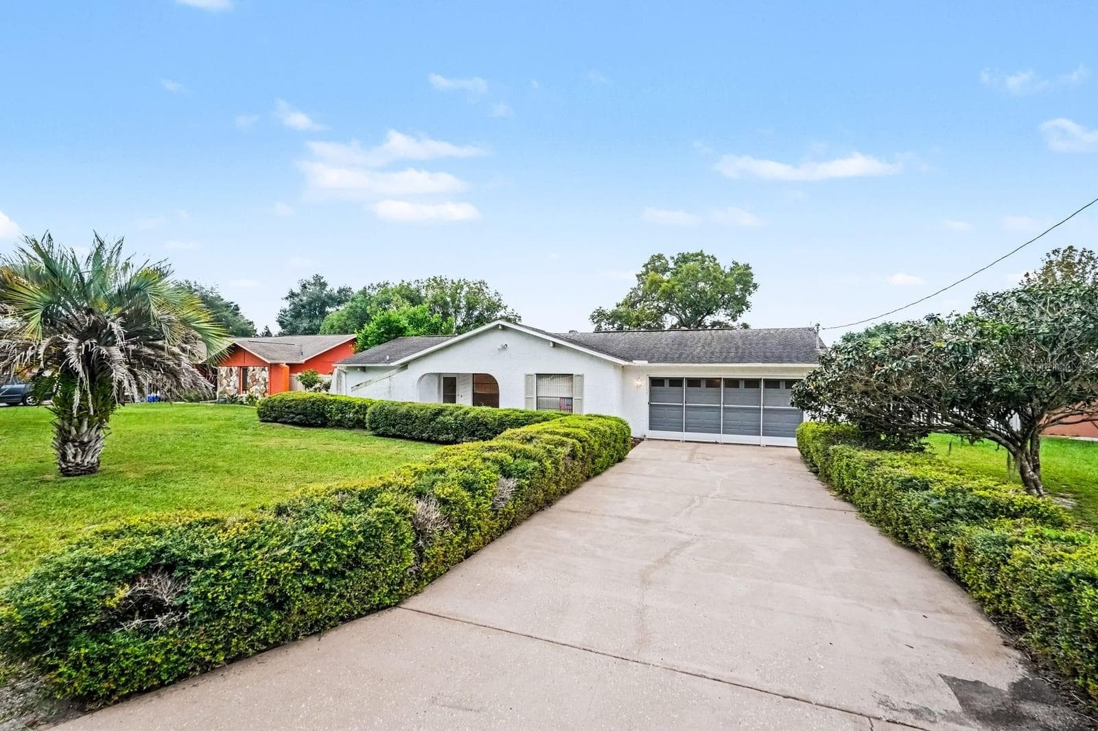 Wide Driveway Leads to Attached Two-Car Garage and Entry - 12128 KATHERWOOD ST #20, SPRING HILL