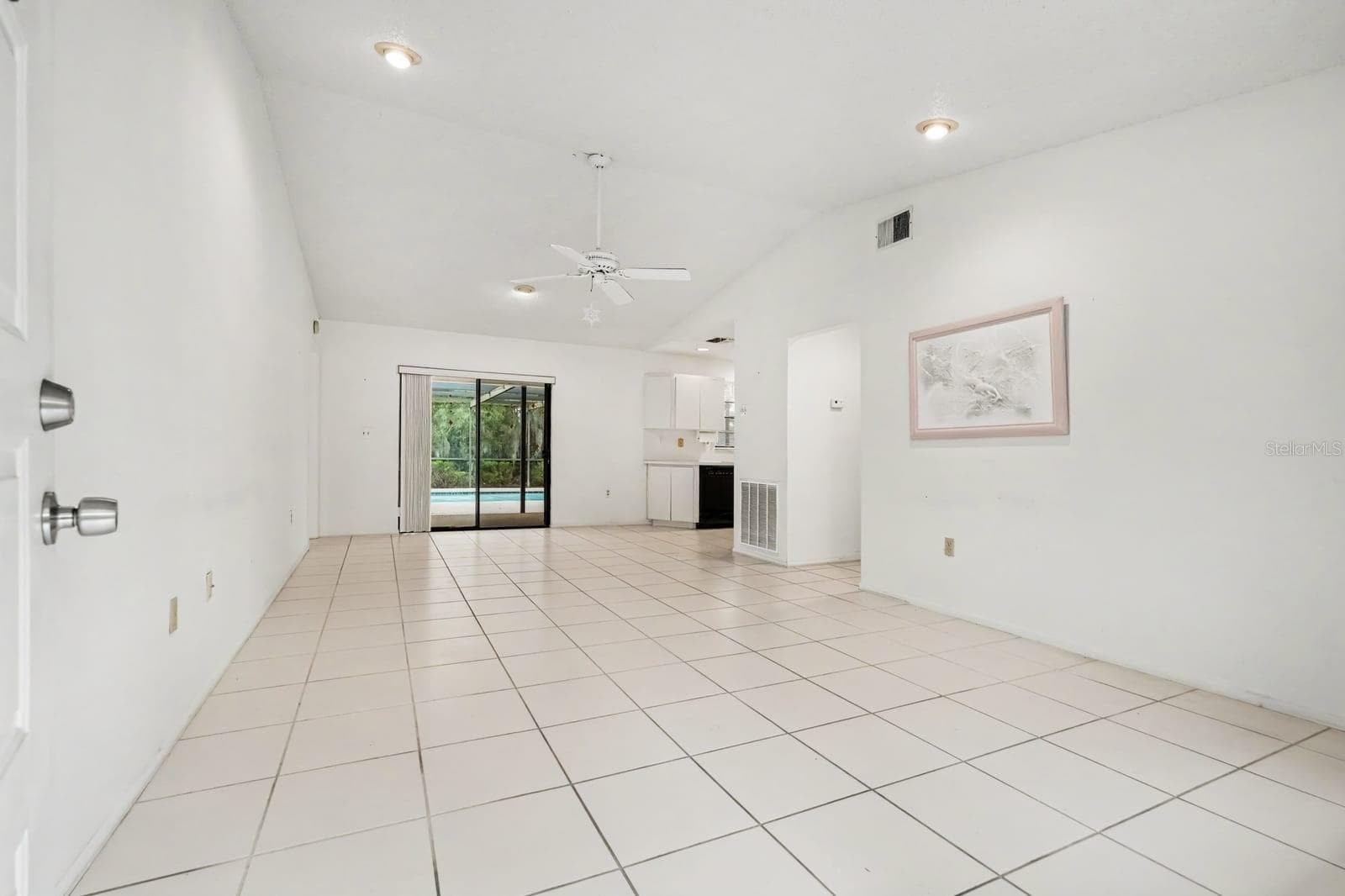 Bright Living Area with Sliding Glass Doors to Backyard and Ceiling Fan - 12128 KATHERWOOD ST #20, SPRING HILL