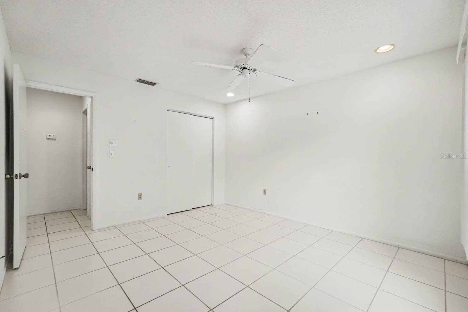 Generously Sized Bedroom with Ceiling Fan and Wall-to-Wall Tile Flooring - 12128 KATHERWOOD ST #20, SPRING HILL