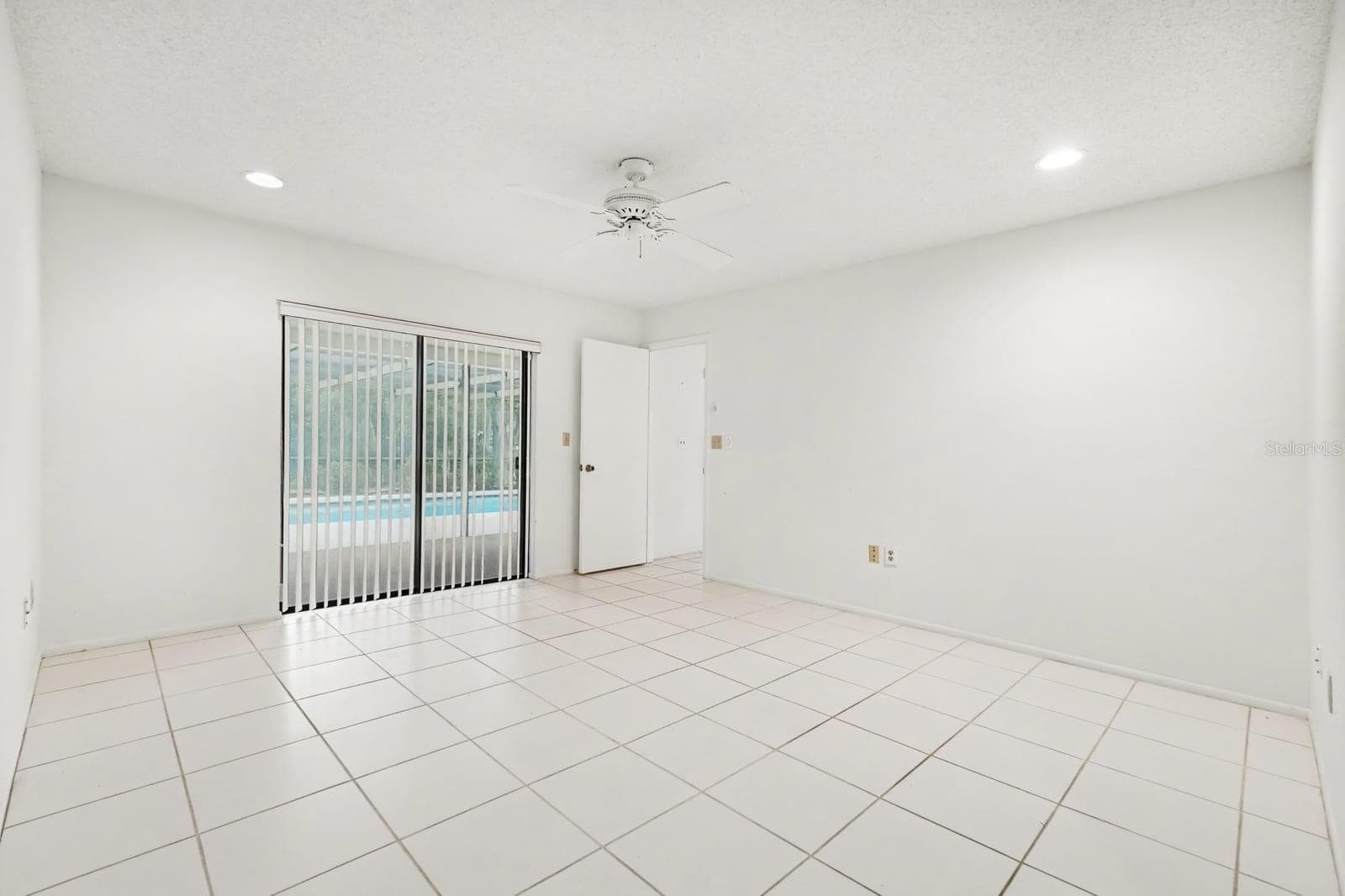 Spacious Room with Sliding Glass Doors to Pool and Patio Area - 12128 KATHERWOOD ST #20, SPRING HILL