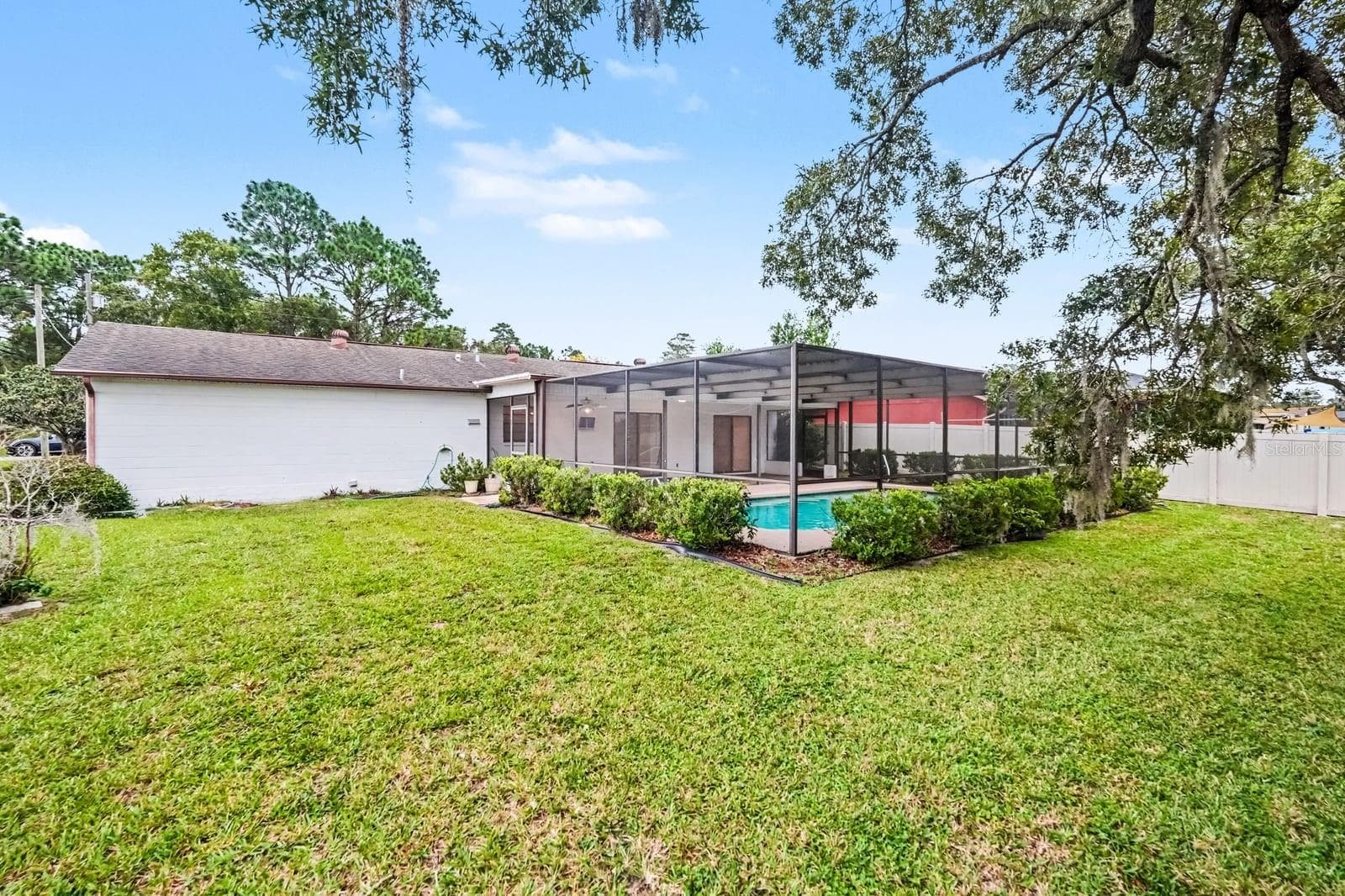 Resort-Style Pool Setting Framed by Mature Oak Trees - 12128 KATHERWOOD ST #20, SPRING HILL