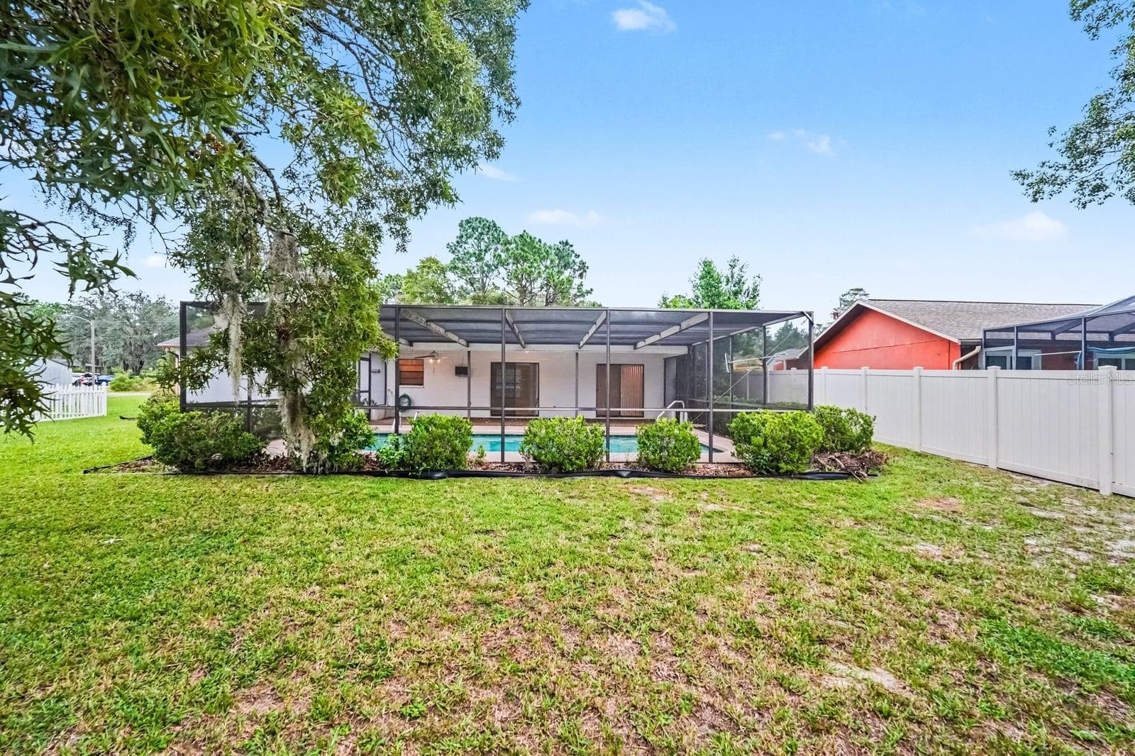 Tranquil Yard with Shaded Trees and Screened Pool Retreat - 12128 KATHERWOOD ST #20, SPRING HILL