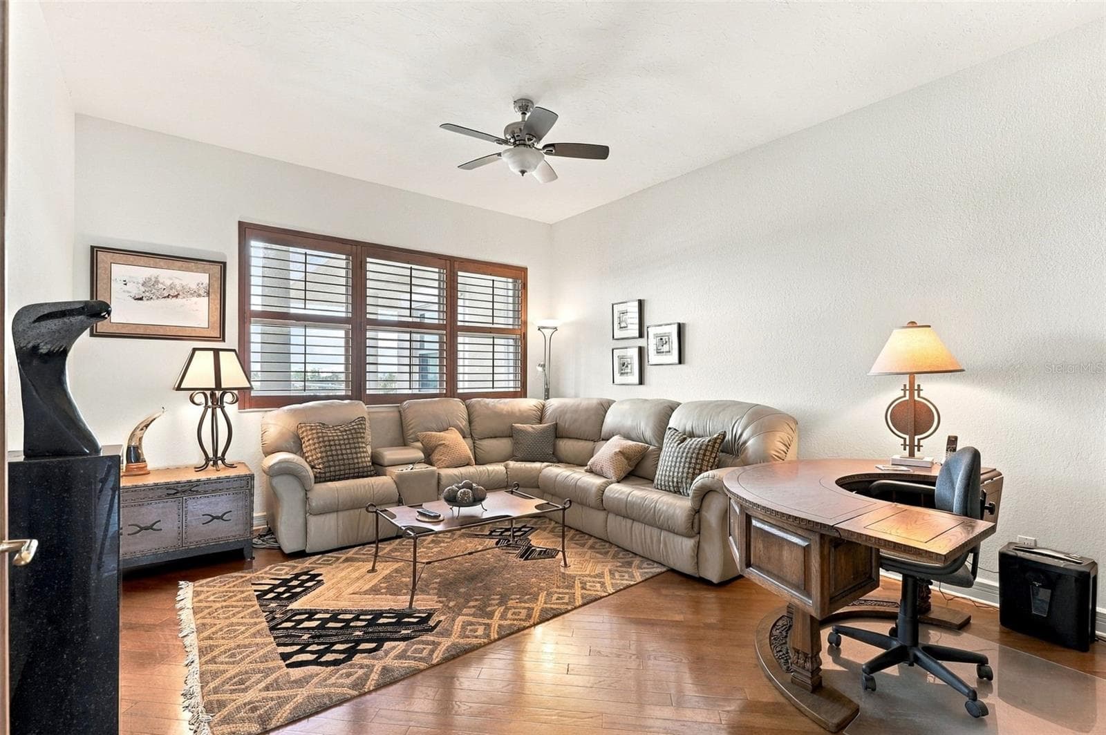 Currently being used as a den, bedroom 3 offers rich engineered hardwood floors. - 2185 GULF OF MEXICO DR #243, LONGBOAT KEY