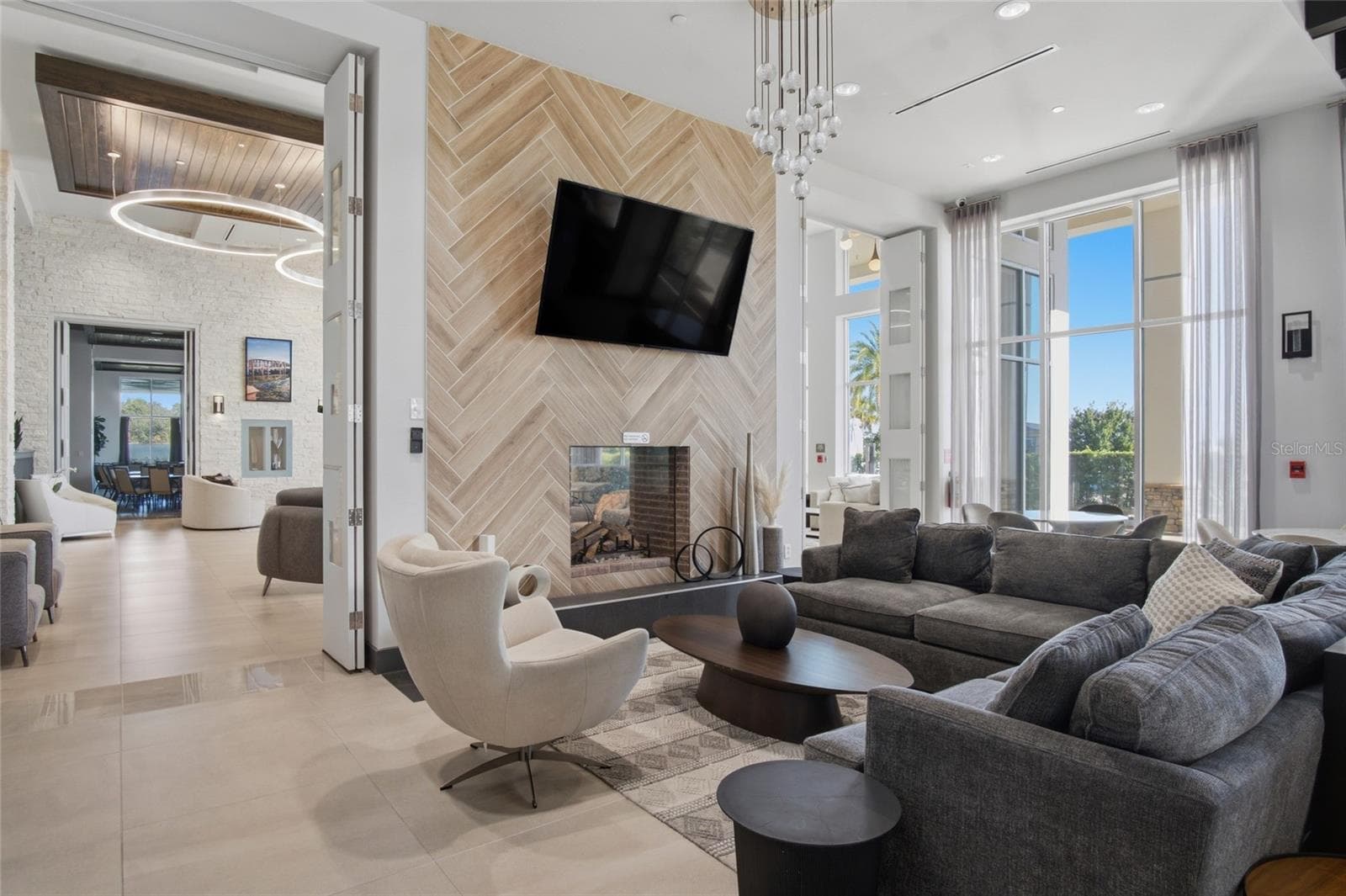 Twin Lake clubhouse lounge and fireplace - 5027 E FOUNTAINWOOD DR, ST CLOUD