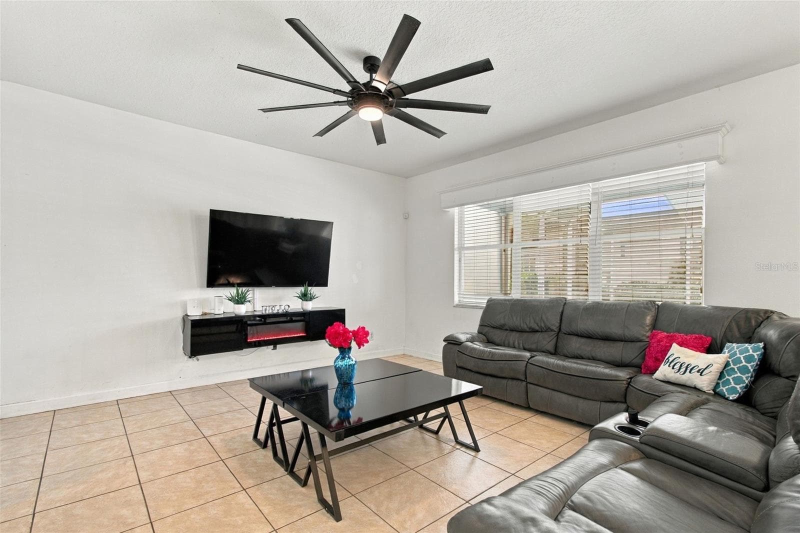 Built in ambiance fireplace will be enjoyed year round. - 19025 FISHERMANS BEND DR, LUTZ