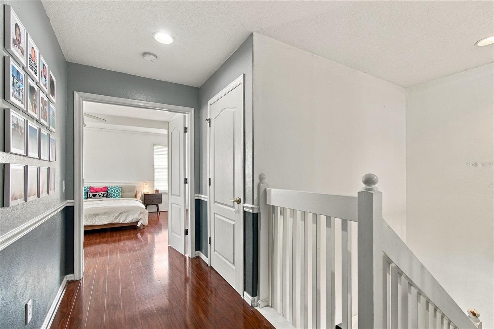 Private hallway leading to a double door entry for the primary suite. - 19025 FISHERMANS BEND DR, LUTZ