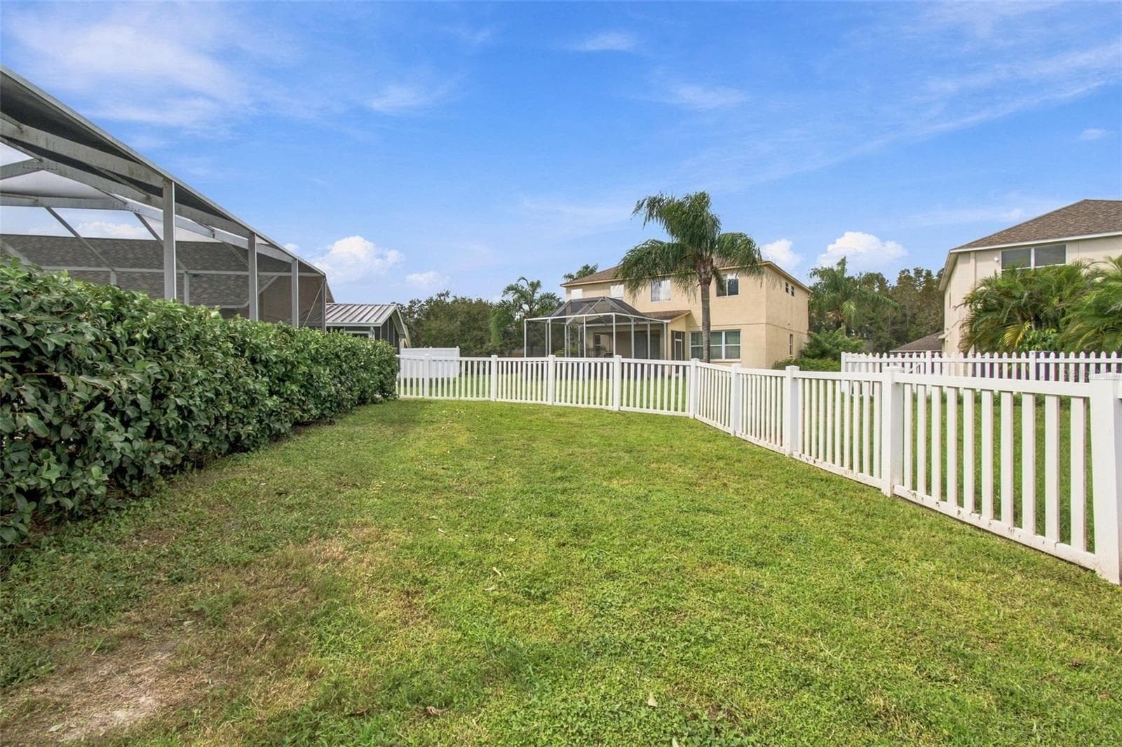 Your home also features a large fenced in backyard with privacy landscape while overlooking a serene pond. - 19025 FISHERMANS BEND DR, LUTZ